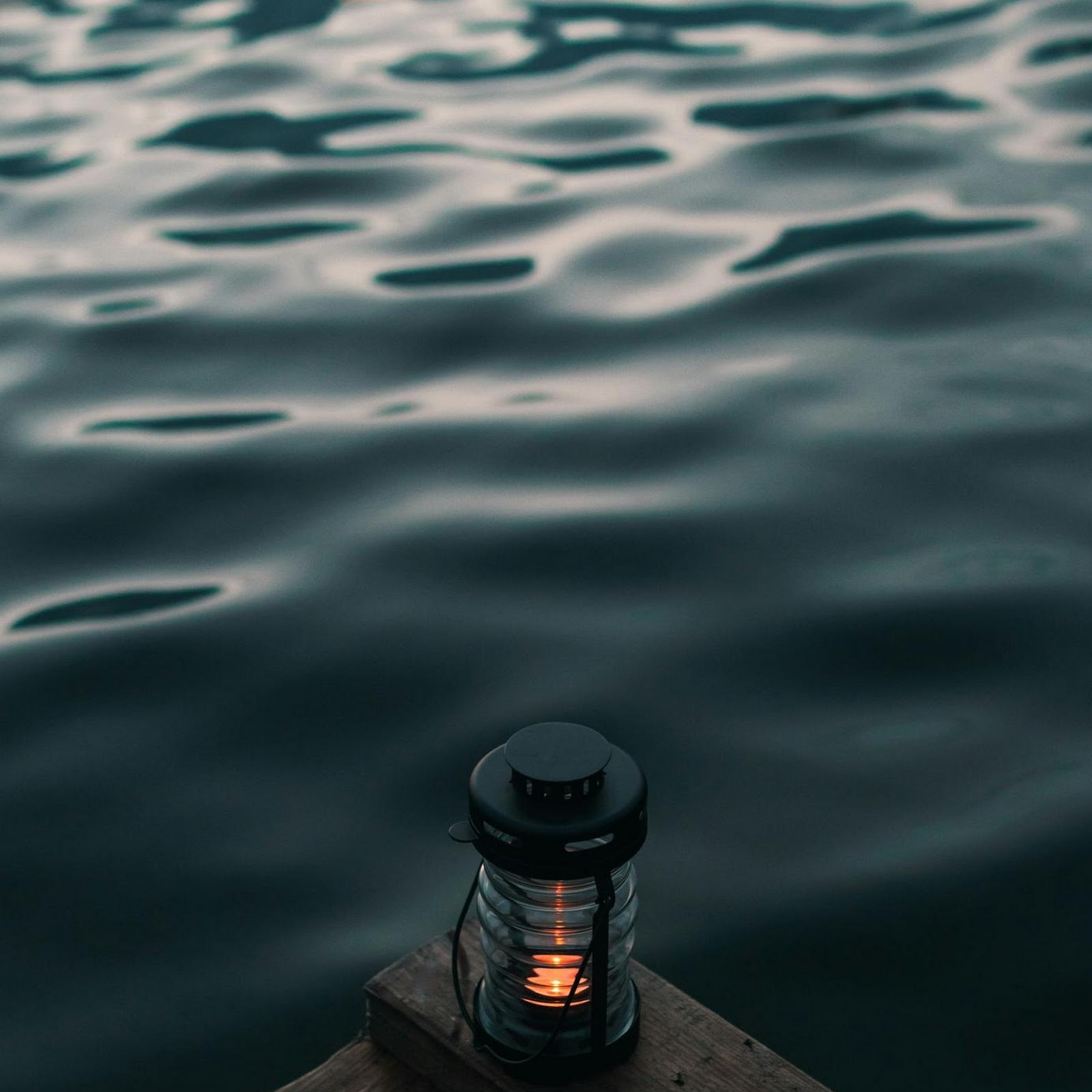 Download Lantern On A Wooden Dock Full HD iPhone