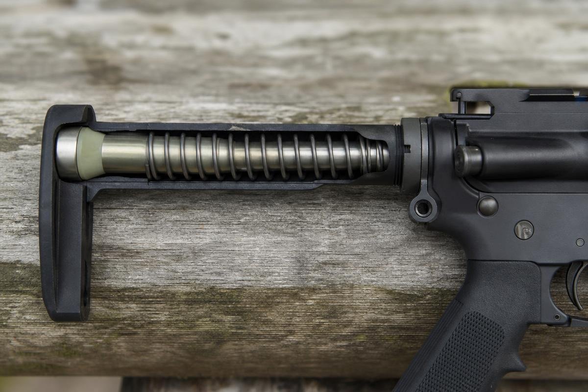 Cutaway view of a buffer and coil spring seated inside an AR-15 buffer tube