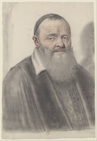 Homme âgé à longue barbe portant une calotte vu presque de face
