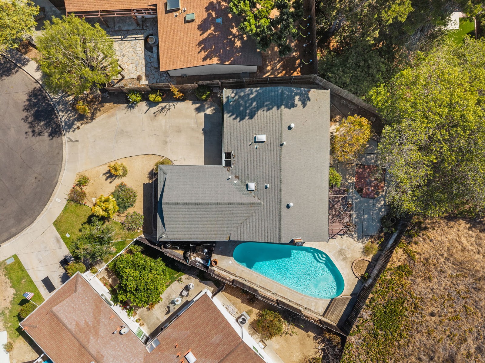 Aerial view of the home, pool and lot