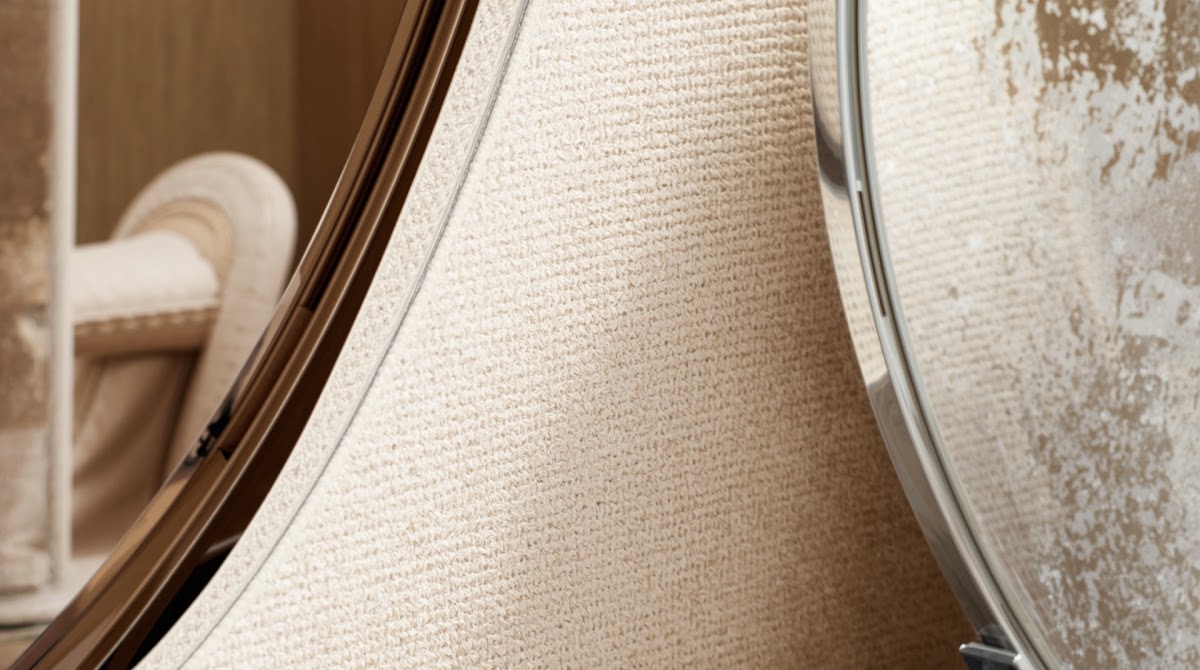 How to Use Chrome Mirrors to Make Small Rooms Feel Brighter - chrome detail beside warm wood grain and textured fabric
