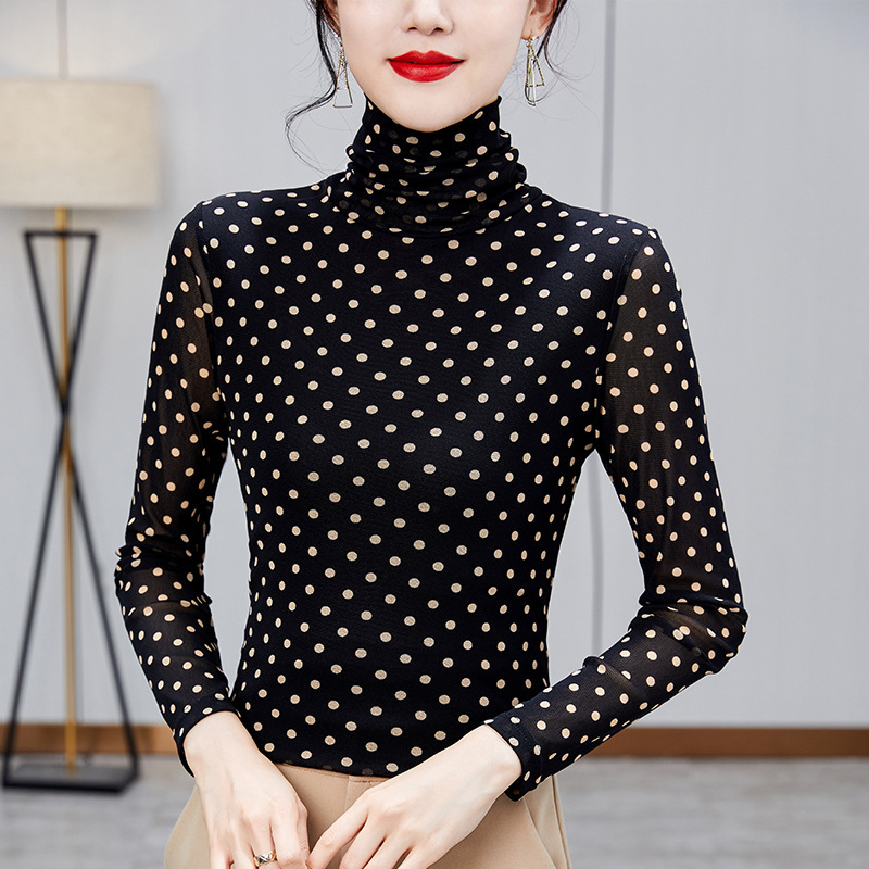 Women’s top with stand-up collar and polka dot pattern