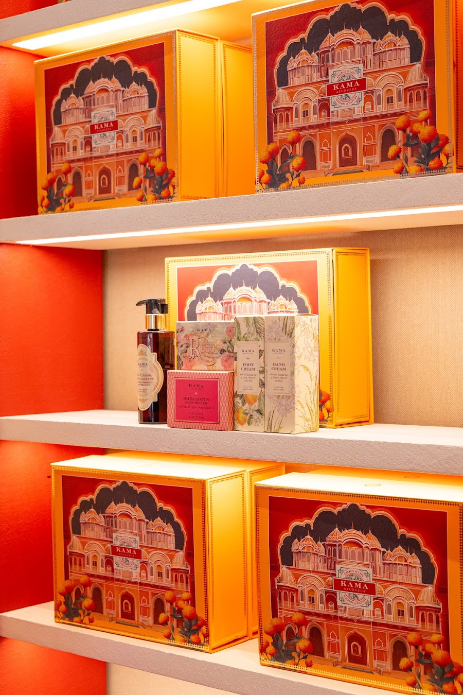 Kama Ayurveda store interior, heritage red, brass and arches, photo 17