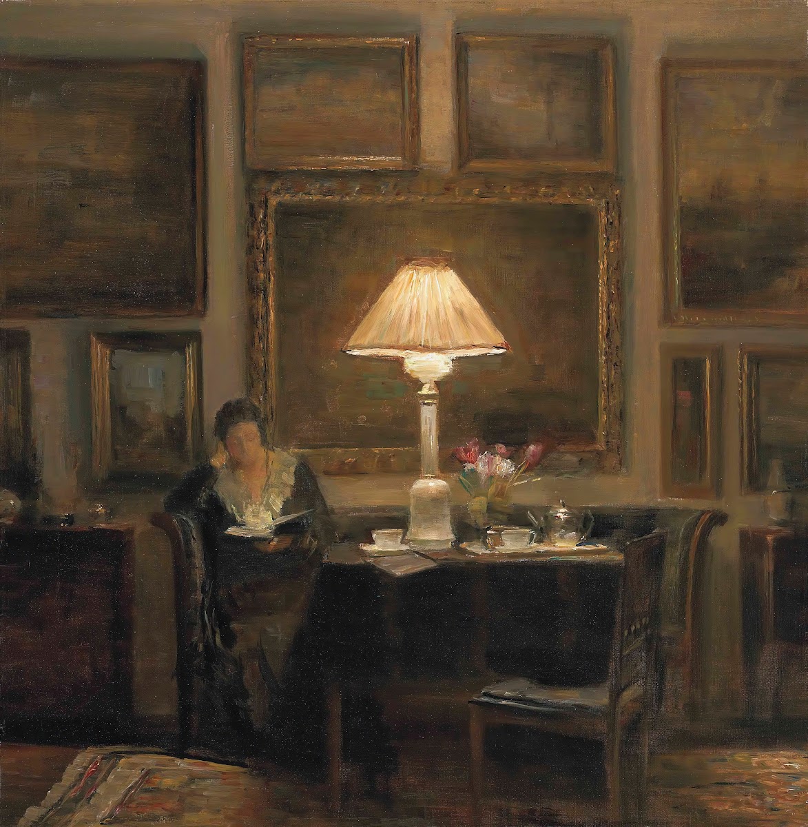A lady reading by lamplight