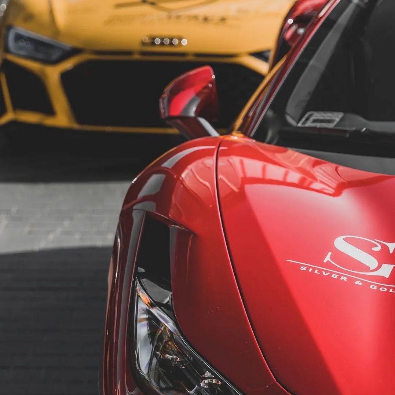 Download Red Ferrari and Yellow Audi Full HD iPhone