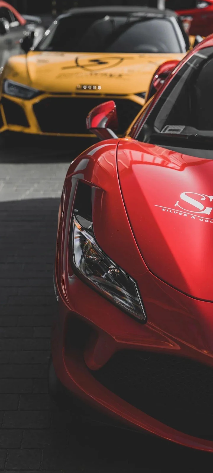 Red Ferrari and Yellow Audi - Automotive Photography Full HD iPhone Wallpaper (1080x2400)
