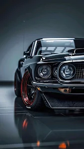 Black muscle car with red rims gleams in dark studio