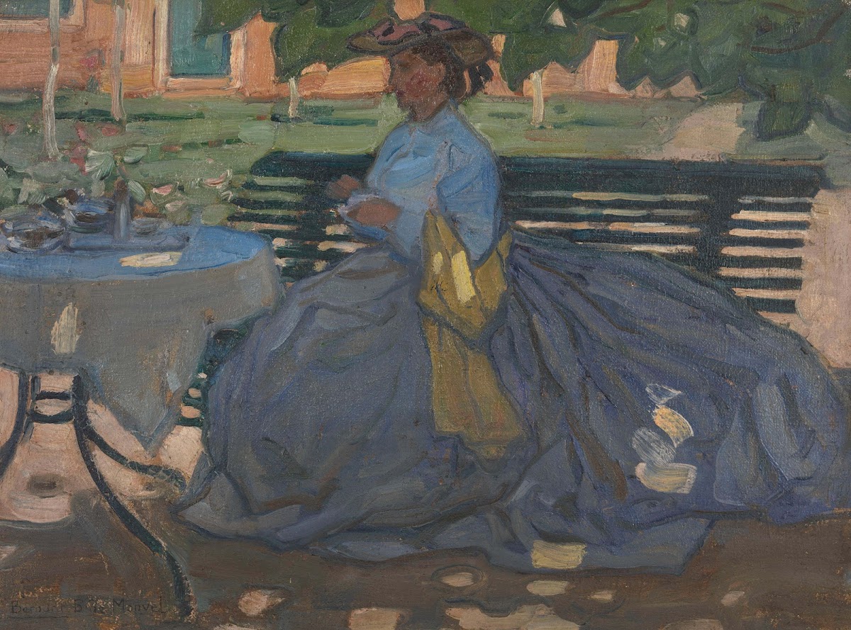 Woman at a garden table circa 1910
