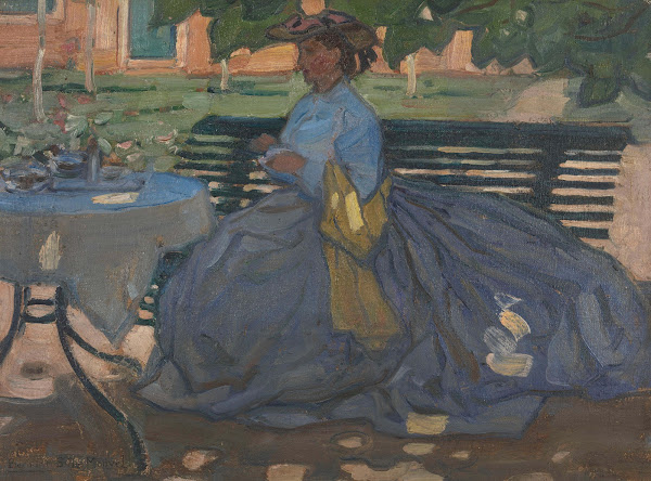 Woman at a garden table circa 1910