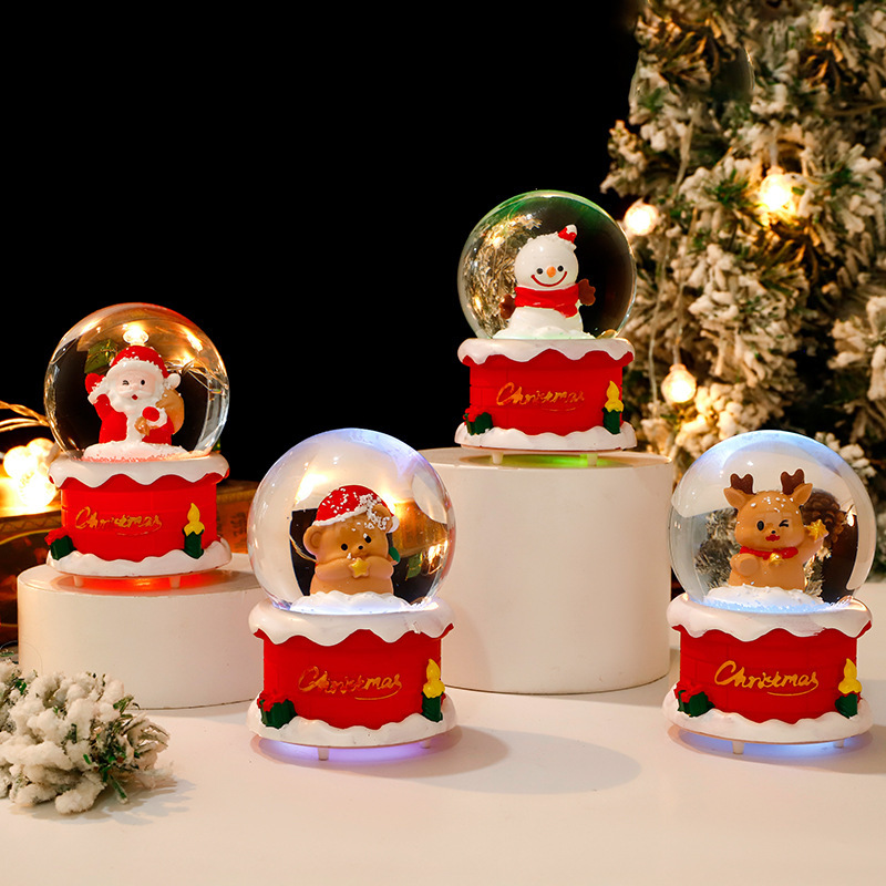 Luminous snow globe with Christmas motifs