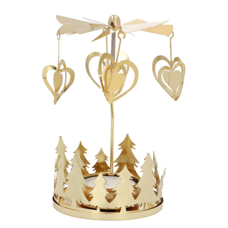 Rotating brass tealight holder with star motif