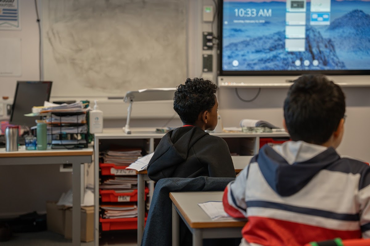 Boys looking at the interactive screen