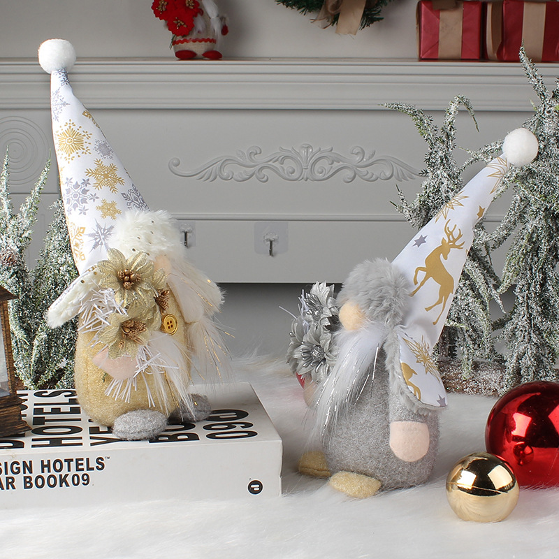 Gnome figure with hat in gold and silver appearance