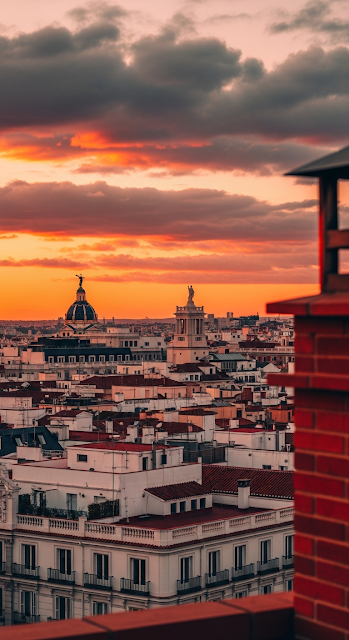 Rooftop View of Madrid Cityscape Silhouette against Fiery Sunset Sky - Free mobile Wallpaper