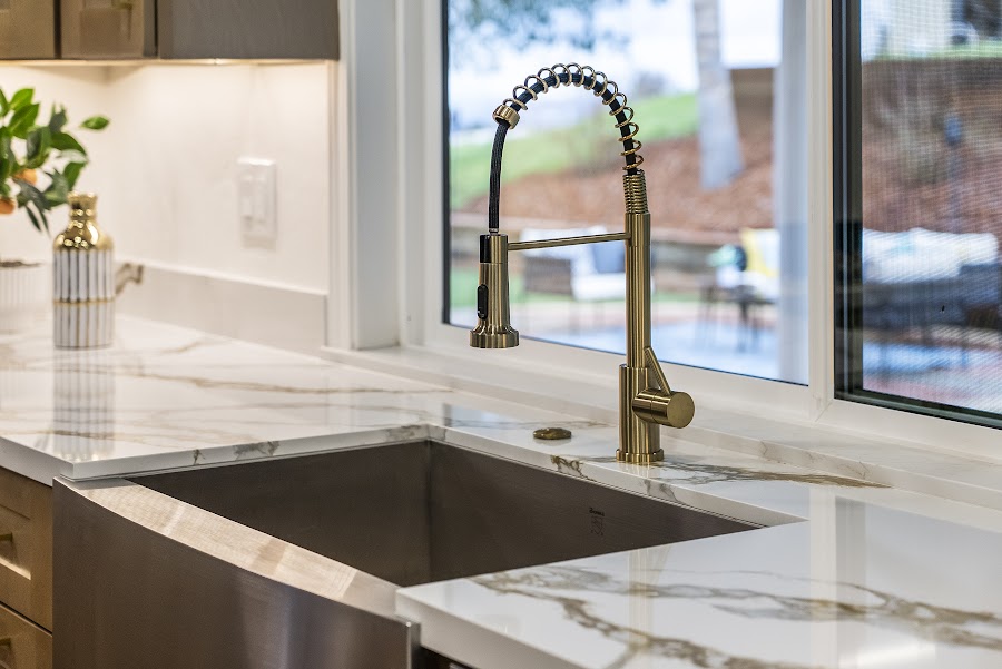 Marble counter and brass faucet detail — 12200 Tesla Rd, by 3 Eye Media