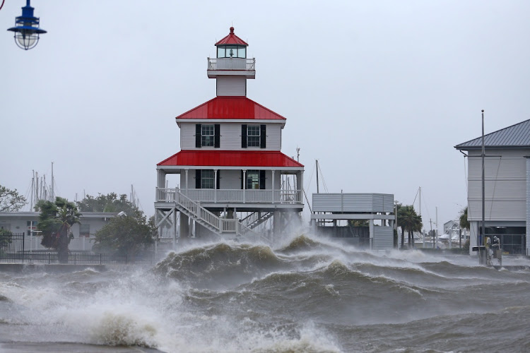 Waves crash against the New Canal Lighthouse on Lake Pontchartrain as the effects of Hurricane Ida begin to be felt in New Orleans, Louisiana, US, in this August 29 2021 file photo. Picture: USA TODAY NETWORK via REUTERS/MICHAEL DEMOCKER