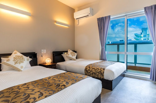 Buy this luxury house in Ishigaki (Japan) - Room with two single beds, exterior view