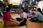 Family members of Sithu, 37, who was killed during a raid by security forces mourn at their home in Thaketa, Yangon, Myanmar on March 13 2021. 