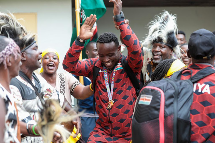 Ferdinard Omanyala being welcomed at the jomo Kenyatta International Airport after winning two gold medals at Africa Senior Athletics Championships in Mauritius.