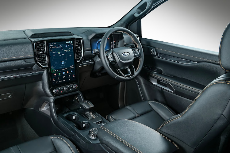 The Wildtrak interior gets smarter decoration with orange stitching and a stubby e-shifter. Picture: SUPPLIED