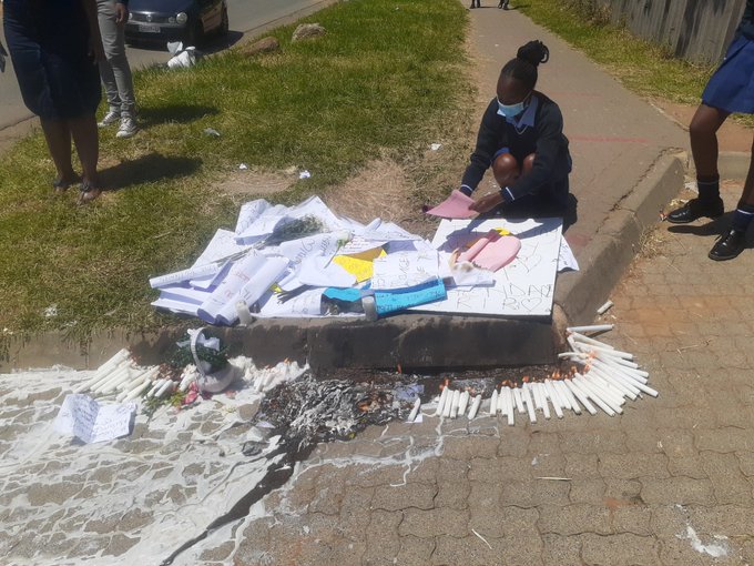 Phomolong secondary school pupils place candles and hand-written cards on the spot where their deputy principal Thembisile Ngendane was shot dead on Friday.