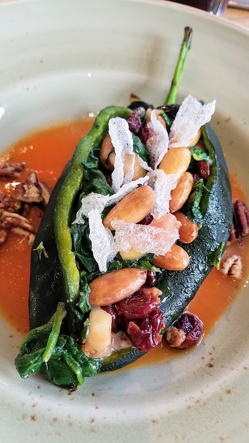 Alto Bajo brunch Plato Fuertes (large plate) of Poblano Chile Relleno with spinach, smoked goat cheese, apples, almonds, and cranberries (can be made vegan by leaving out the cheese).