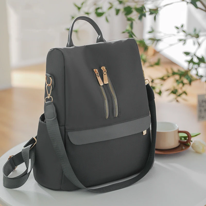 Sac à dos unisexe rétro en tissu Oxford pour la mode. Confortable et résistant, idéal pour le quotidien, les voyages et un style intemporel.
