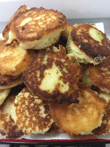 My grandma used to make fried Cornbread. I took what i remember about hers and added my own twists, like green onion, grated onion  and sugar (sugar helps them brown nicely but these are not sweet).
