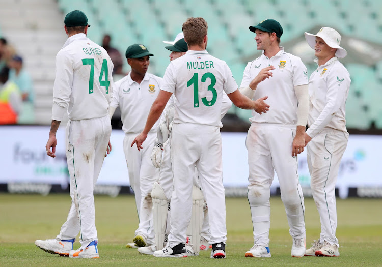 Proteas all-rounder Wiaan Mulder celebrates the wicket of Bangladesh's Mehidy Hasan Miraz with his teammates on day three of the 1st Test at Kingsmead Stadium.