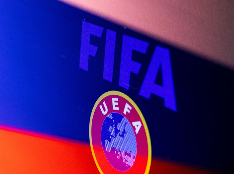 Fifa and Uefa logos are displayed in front of the Russian flag in this illustration taken February 28 2022. REUTERS/DADO RUVIC