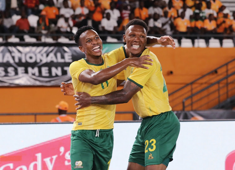 Themba Zwane celebrates his goal for Bafana Bafana with teammate Lebo Mothiba in the international friendly against Ivory Coast at Stade Félix Houphouët-Boigny in Abidjan, Ivory Coast on Tuesday night.