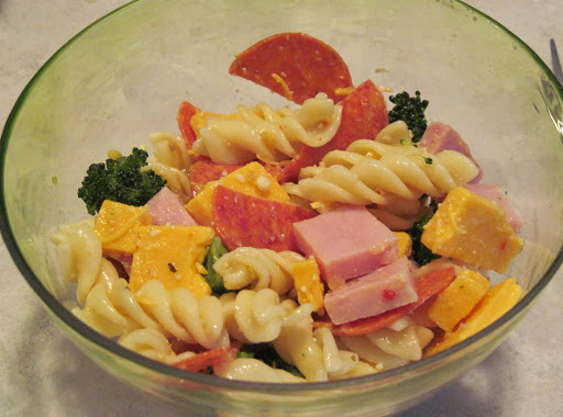 Easy Pasta salad with broccoli,cheese, pepperoni, ham, and spiral pasta.