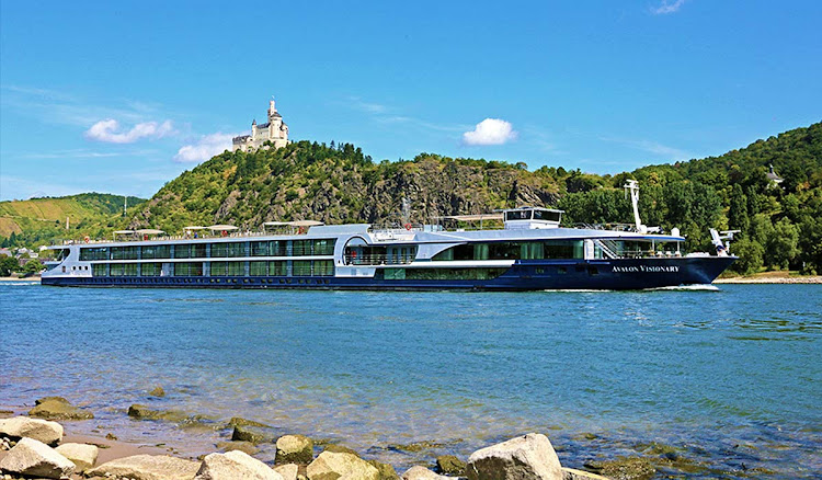 Marksburg Castle looms in the distance as Avalon Visionary sails the Rhine River.