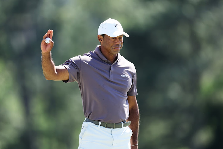 Tiger Woods of the United States reacts on the 18th green during the second round of the 2024 Masters Tournament at Augusta National Golf Club on April 12, 2024 in Augusta, Georgia.