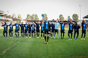 Percy Tau and his Club Brugge teammates celebrate with their fans. 