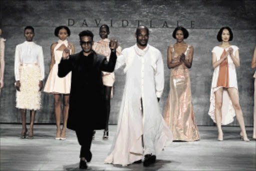 COUP: Designer David Tlale and Tyson Beckford during the Mercedes-Benz Fashion WeekPHOTO: dan lecca