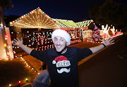Matthew Haines in Lady Grey Street, Fish Hoek, where he has covered his house with 120,000 Christmas lights.