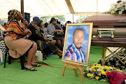 Family members during the funeral   of Papiki Mokolobate who was laid to rest at Miga Cemetery in Ramatlabama, North West, on Saturday. 