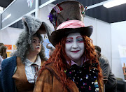 The Mad Hatter and White Rabbit from 'Alice in Wonderland' take a stroll through the stalls at Comic Con Africa 2019.