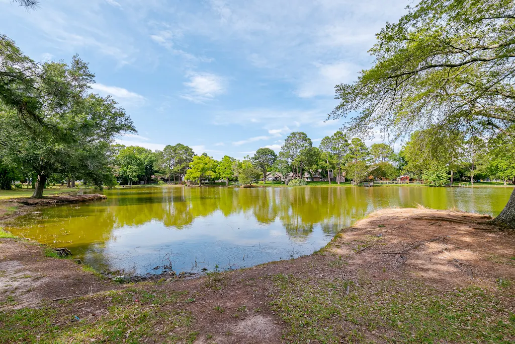 On-site pond with trees surrounding