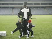 Puppeteer with puppets dressed in Orlando Pirates regalia