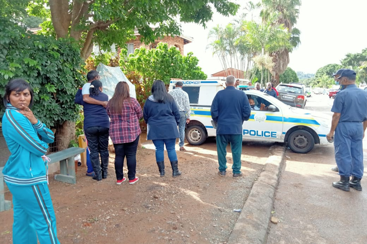 A police van at the scene of a collapsed home in Lotus Road in Springfield, Durban, where the body of a police constable was recovered on Tuesday.