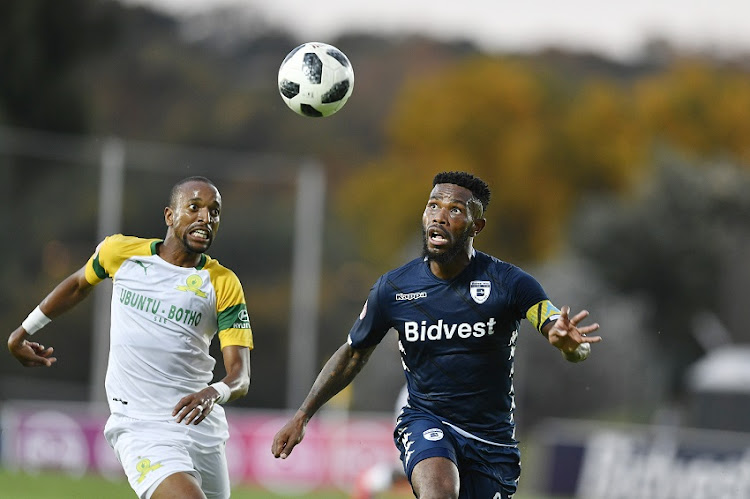 Tiyani Mabunda of Mamelodi Sundowns and Thulani Hlatshwayo of Bidvest Wits during the Absa Premiership match between Bidvest Wits and Mamelodi Sundowns at Bidvest Stadium on February 23, 2019 in Johannesburg, South Africa.