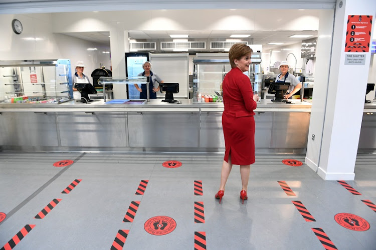 First Minister of Scotland Nicola Sturgeon stands in the canteen with social distancing markers on the floor as she visits West Calder High School amid the coronavirus disease (Covid-19) outbreak, in West Calder, Scotland. File photo