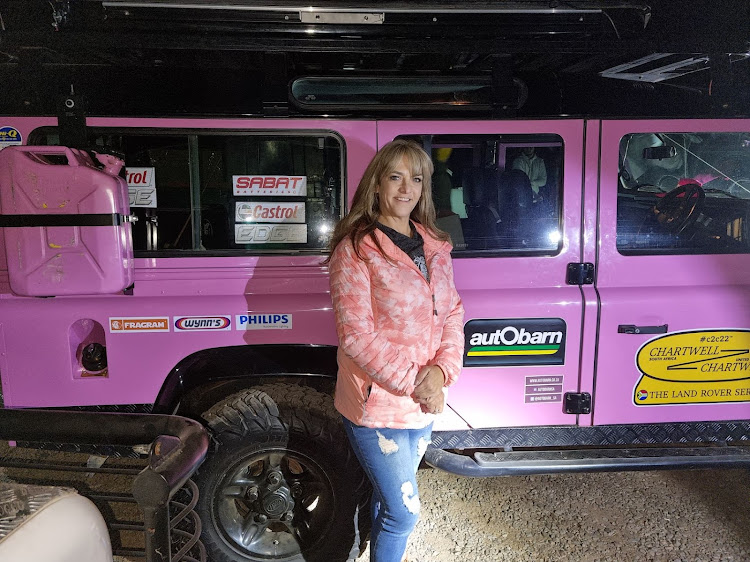 Alison Grunewald with her distinctive pink Land Rover Defender 110. Picture: SUPPLIED