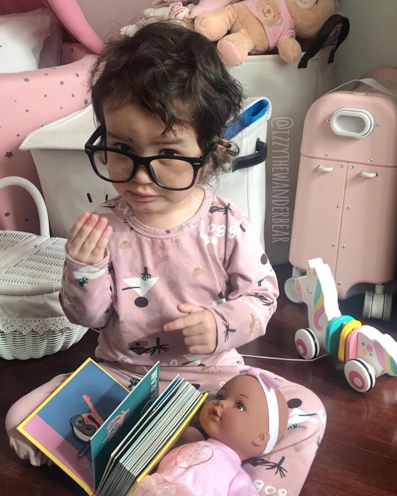 Izzy The Wander Bear: a baby and a book.