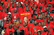 Supporters of the Economic Freedom Fighters (EFF) display a placard bearing the face of  party leader Julius Malema during the launch of its  election manifesto in Soshanguve, near Pretoria, at the weekend. 