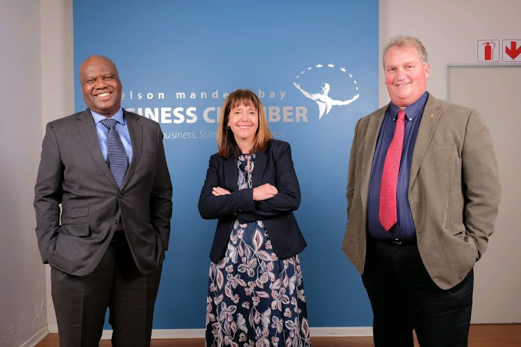 Nelson Mandela Bay Business Chamber chief executive Denise van Huyssteen with new president Loyiso Dotwana, left, and outgoing president Andrew Muir