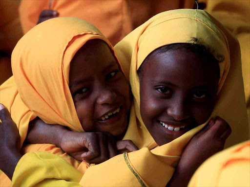 Somali refugee girls attend Koran classes at the Liban integrated academy at the Ifo refugee camp in Dadaab, near the Kenya-Somalia border, in Garissa County, August 2, 2011. /REUTERS