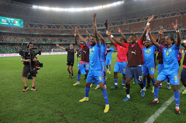 DR Congo players celebrates with teammates a victory during the 2023 Africa Cup of Nations quarterfinal match against Guinea at Alassane Ouattara Stadium in Abidjan, Cote dIvoire on 2 February 2024.